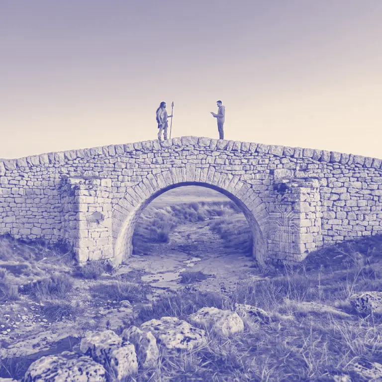 Stone Age Web - Deux silhouettes se rencontrent sur un pont de pierre entre l'âge de pierre et l'ère numérique, dans la campagne aveyronnaise
